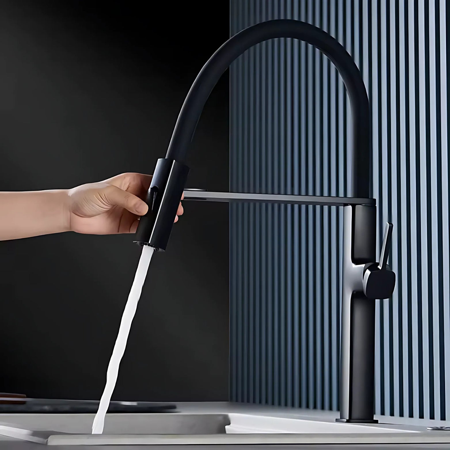 Black premium kitchen faucet with water flowing, against a dark background