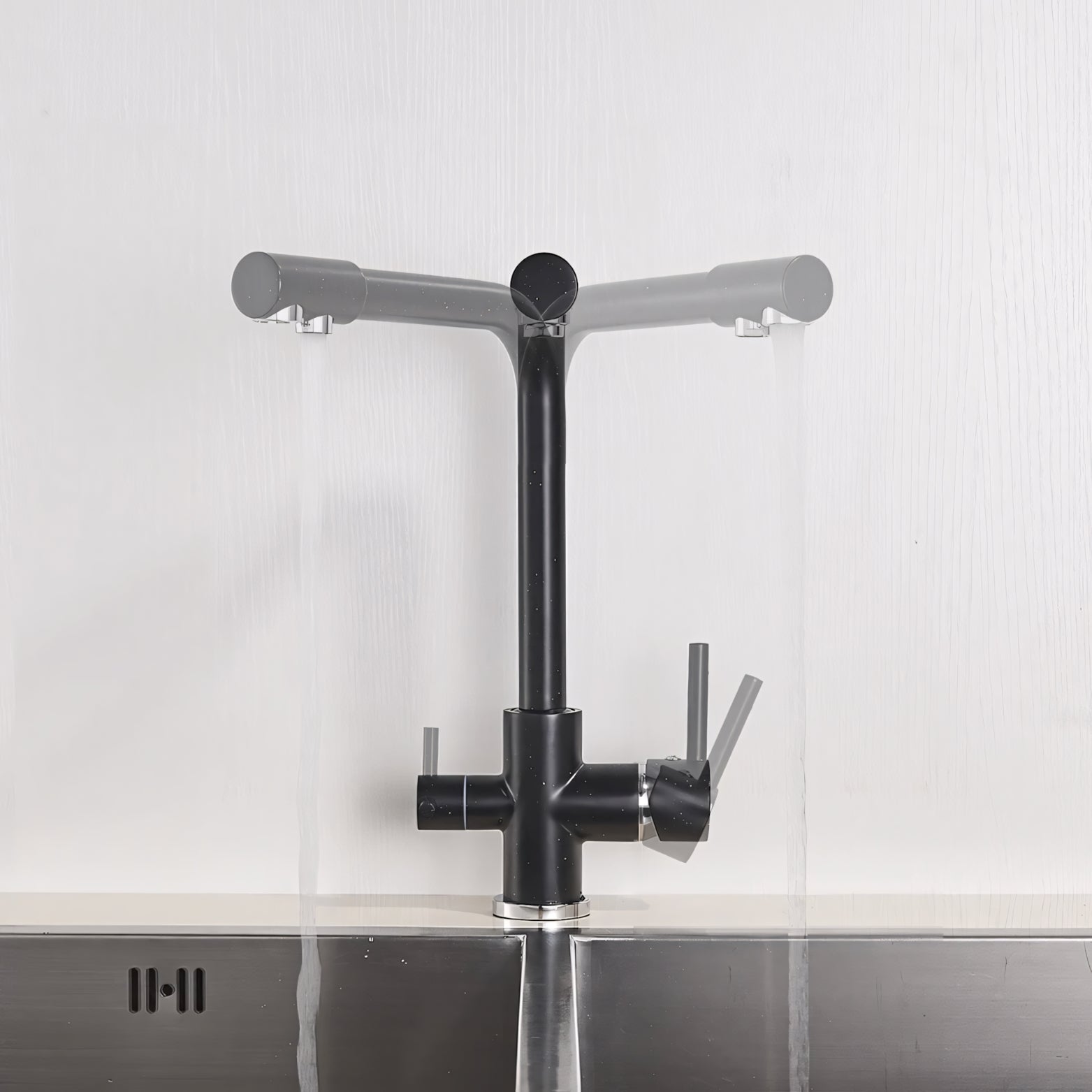 Black kitchen faucet on a white wall with a metallic finish.