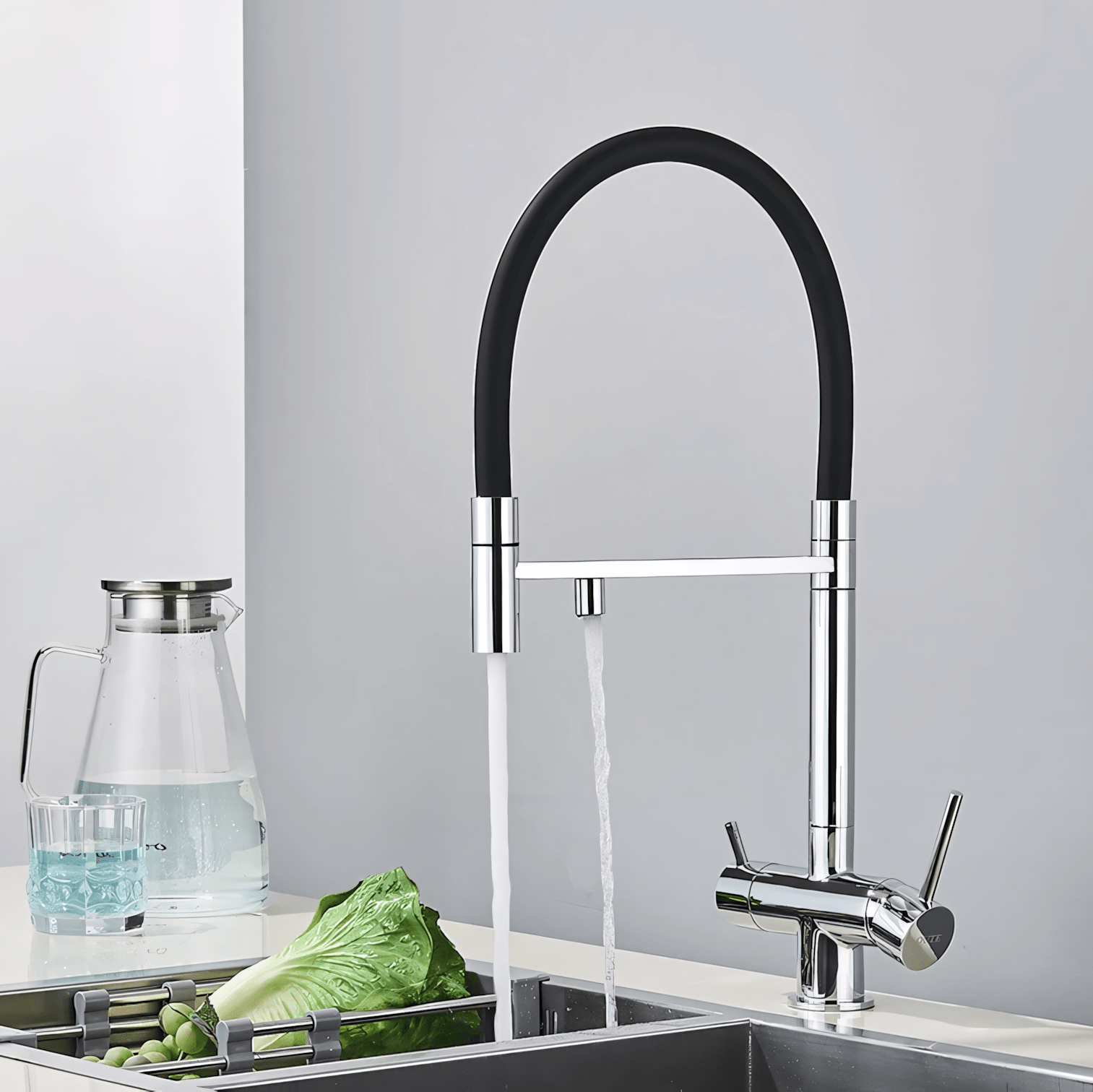 Modern kitchen faucet with a black handle and silver body, set against a gray background.